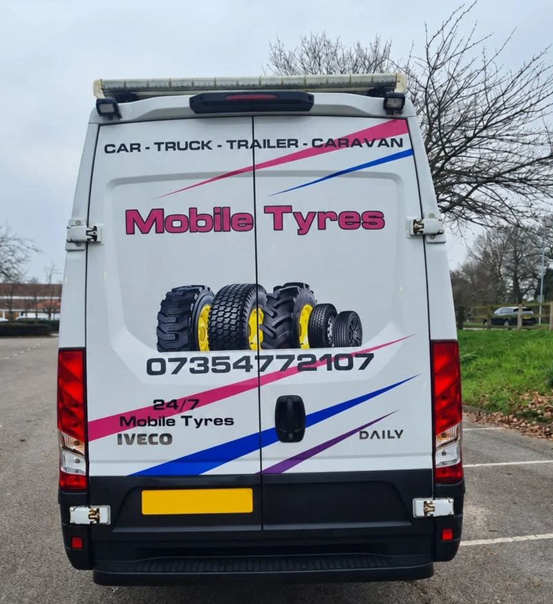Back doors of Craig's van showing Mobile Tyres and 07354 772107