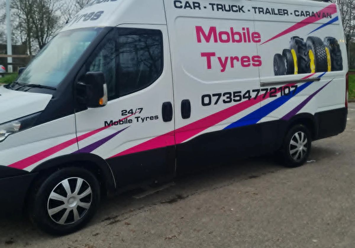 Craig's white van, sign-written Mobile Tyres with 07354 772107 on the side